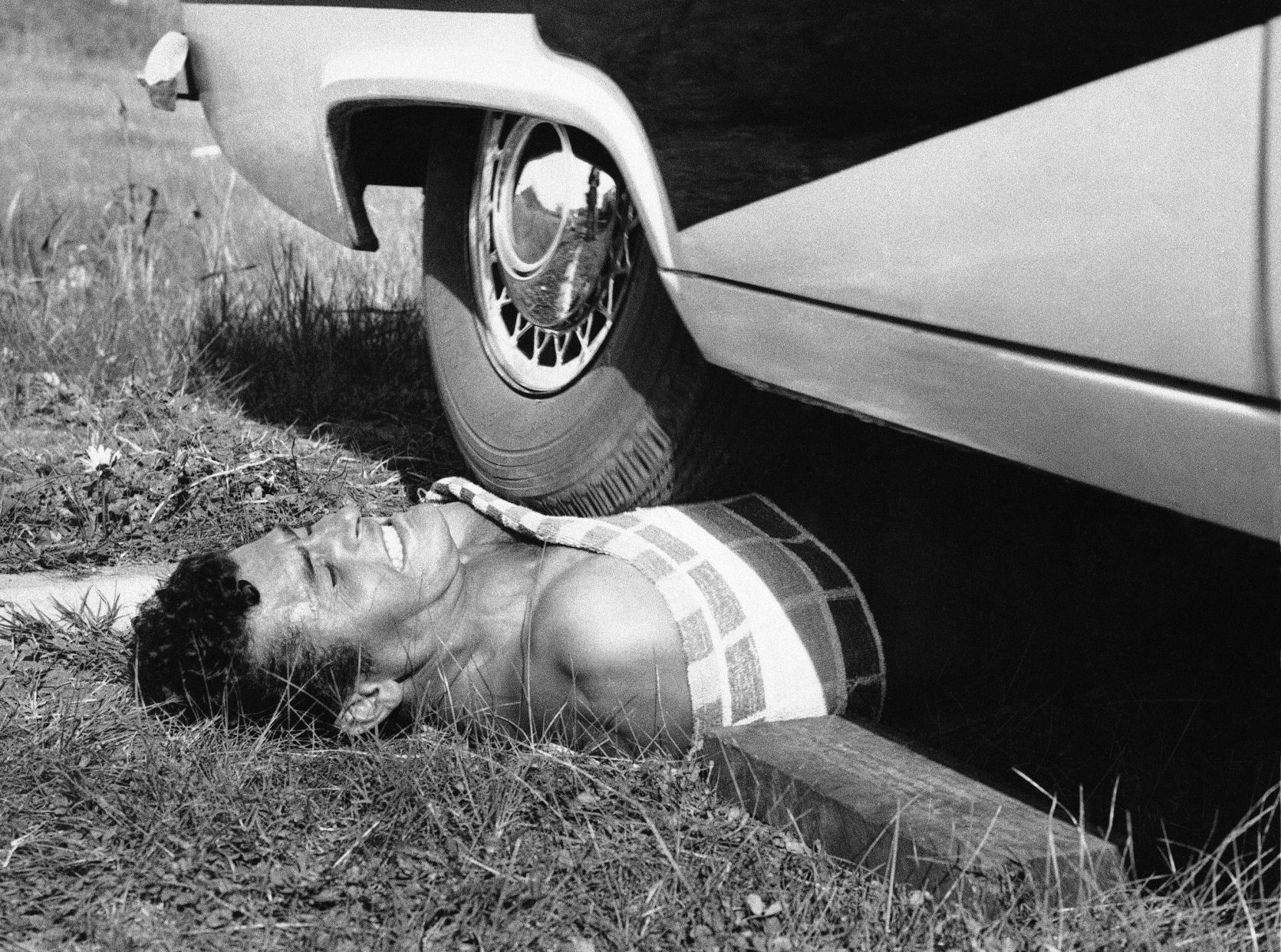 1960: Car driven across chest